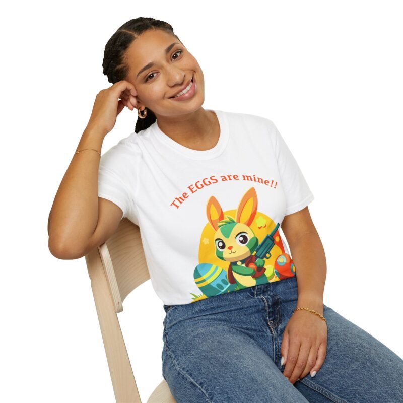 a woman sitting on a chair with white shirt, there is an illustrated bunny holding a gun surrounded by easter eggs