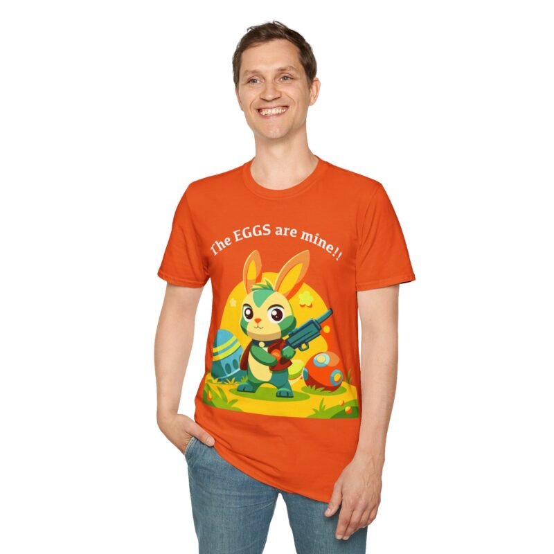a man wearing a t-shirt with a cartoon rabbit and holding a gun with the words the eggs are mine