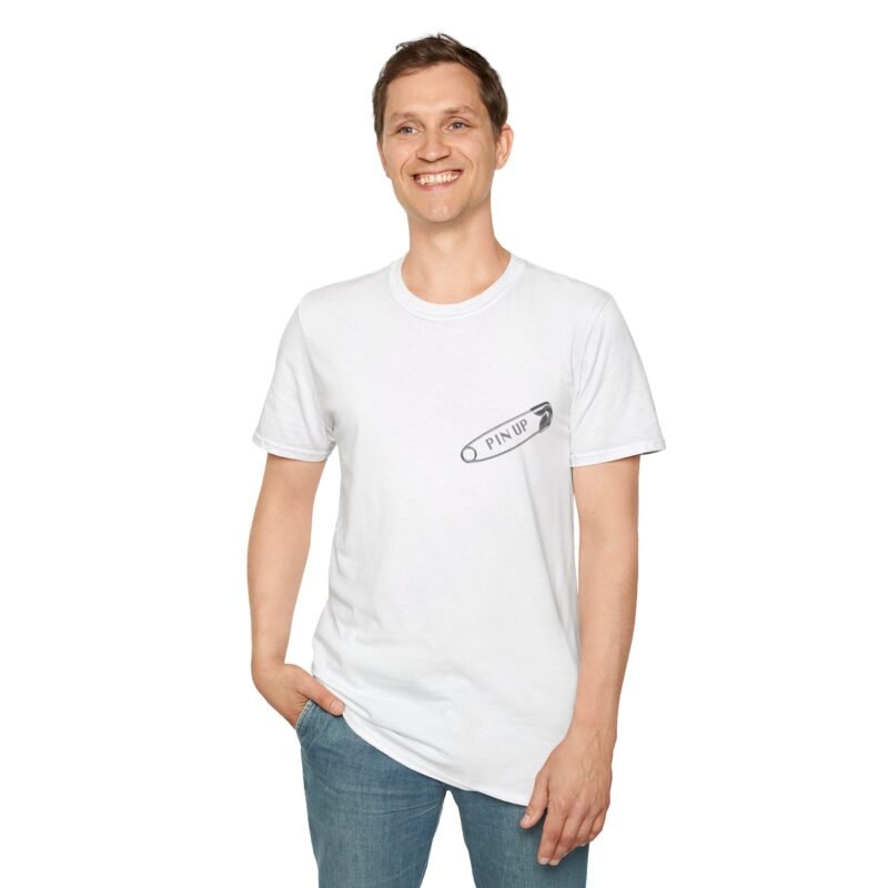 Man wearing a white t shirt with a safty pin on the front