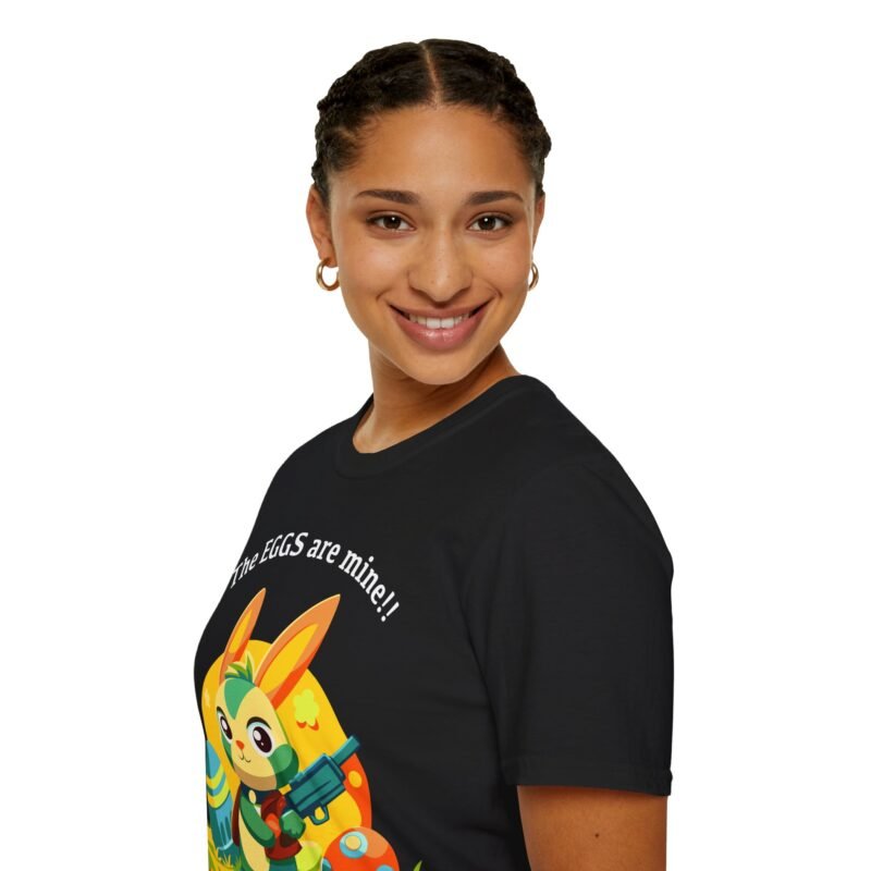 a woman smiling at the camera with t shirt that says the eggs are mine with bunny with a gun